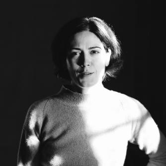 A black and white photo of Kamila Mamadnazarbekova