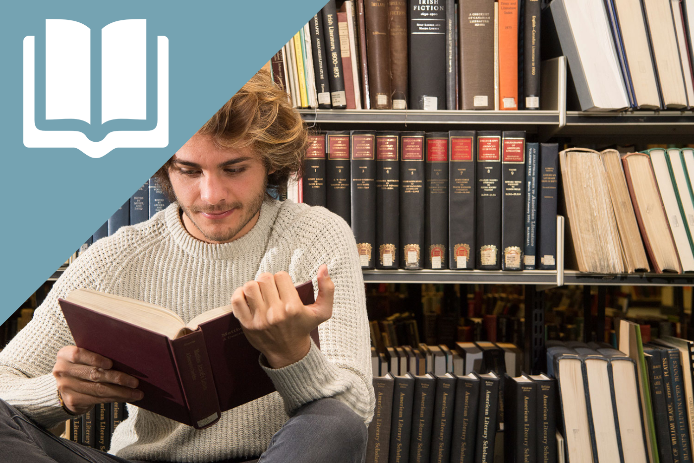 person reading by shelf of books