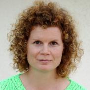 Student with curly hair and green shirt