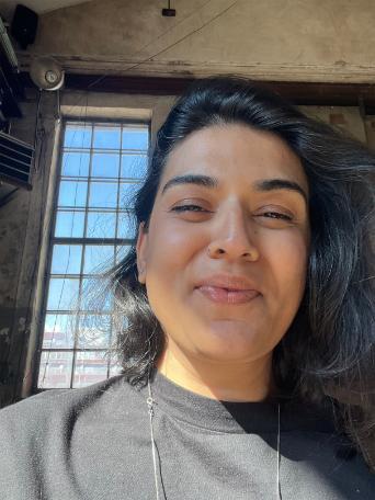 Student smiling by window