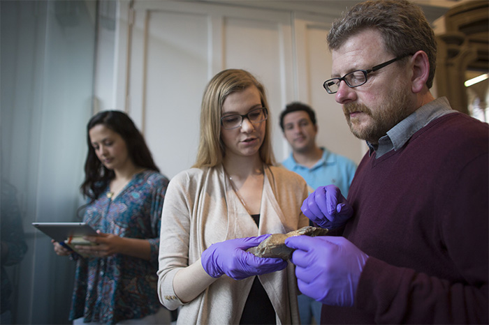 Researchers examine an artefact