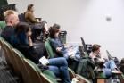 Attendees of SGSAH Summer School 2022 sitting in an auditorium watching a keynote lecture